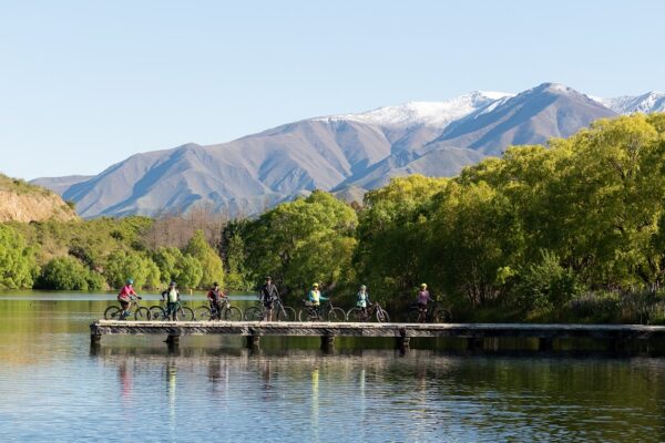People riding bicycles in Lake Tekapo