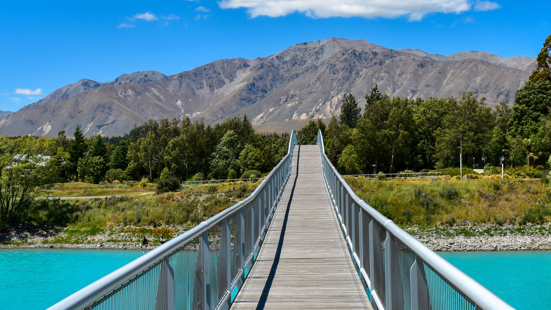 Bridge crossing the turquoise waters of Lake Tekapo